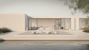 Minimalist modern house with large glass windows and sliding doors, white exterior walls, outdoor seating area, and a reflecting pool in front. Sparse landscaping with low green shrubs frames the serene scene.