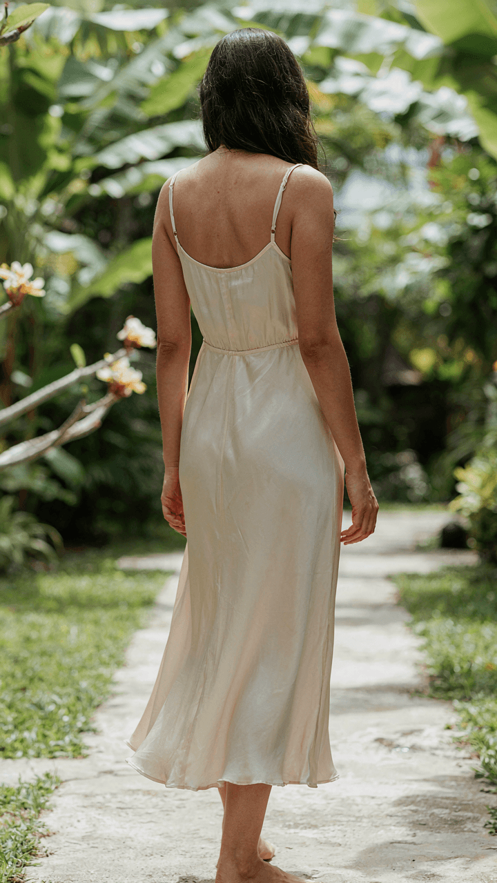 A person wears a light, flowing cotton dress, showing comfort and elegance.