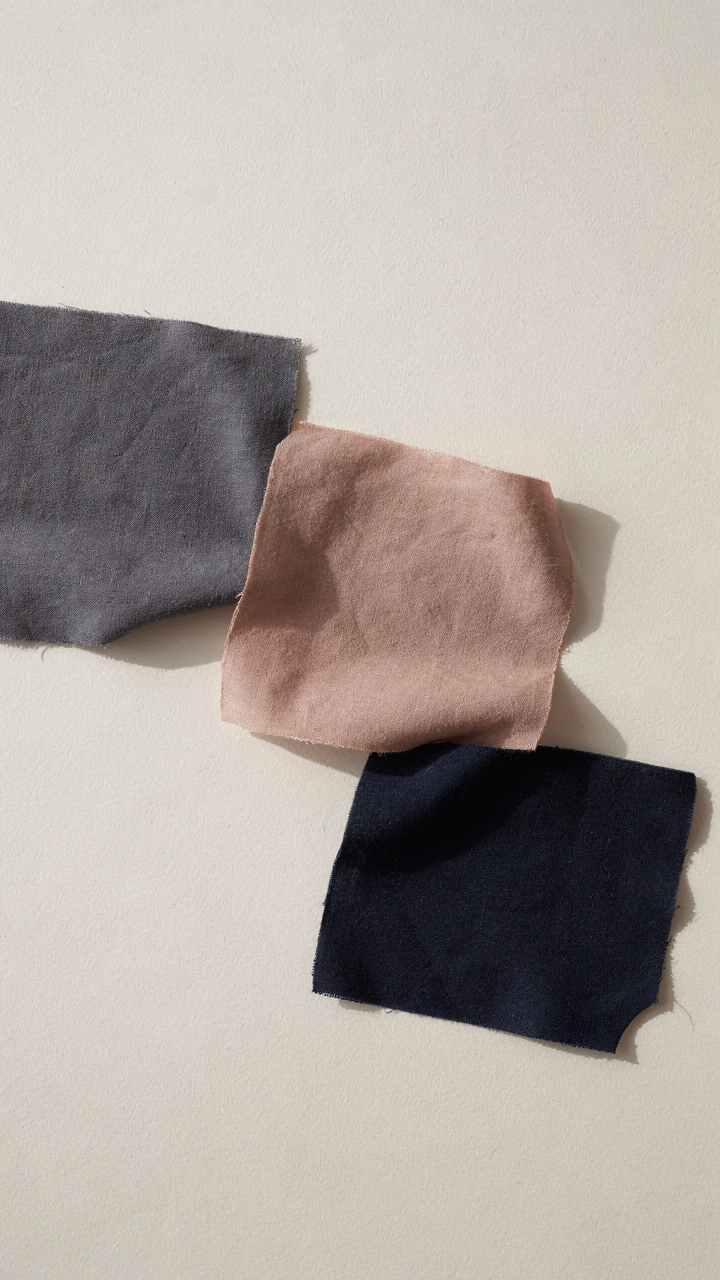 Fabric swatches in muted tones like charcoal gray and dusty rose.