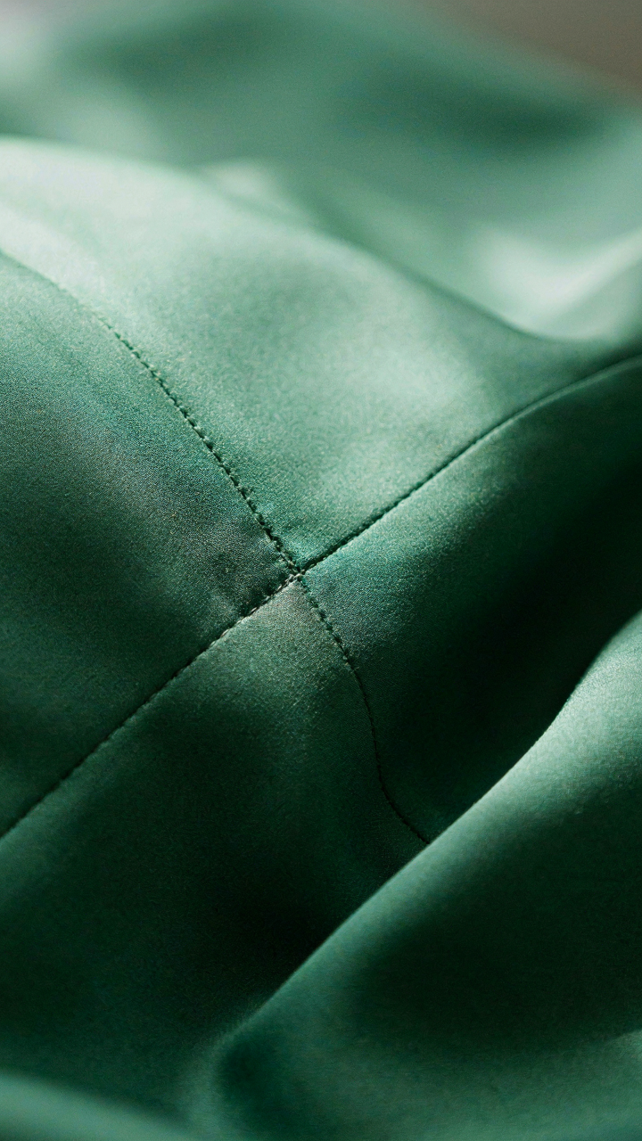 Close-up of a high quality dress seam with visible French stitching.