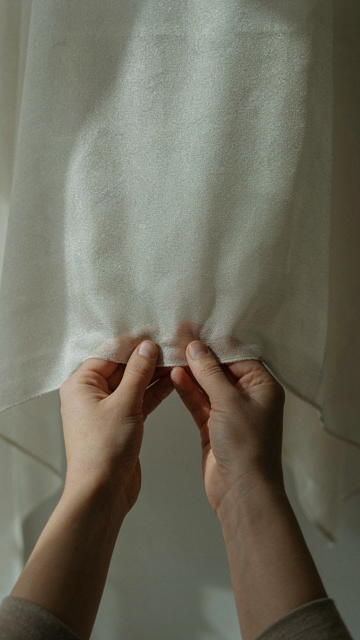 Fabric sample held in direct sunlight to test its response to heat.