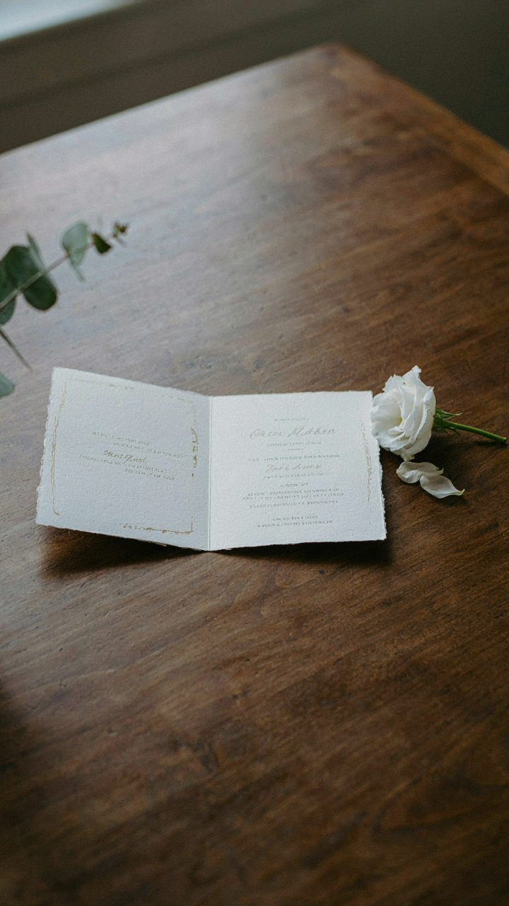 An elegant wedding invitation shows 'cocktail attire' as the dress code.