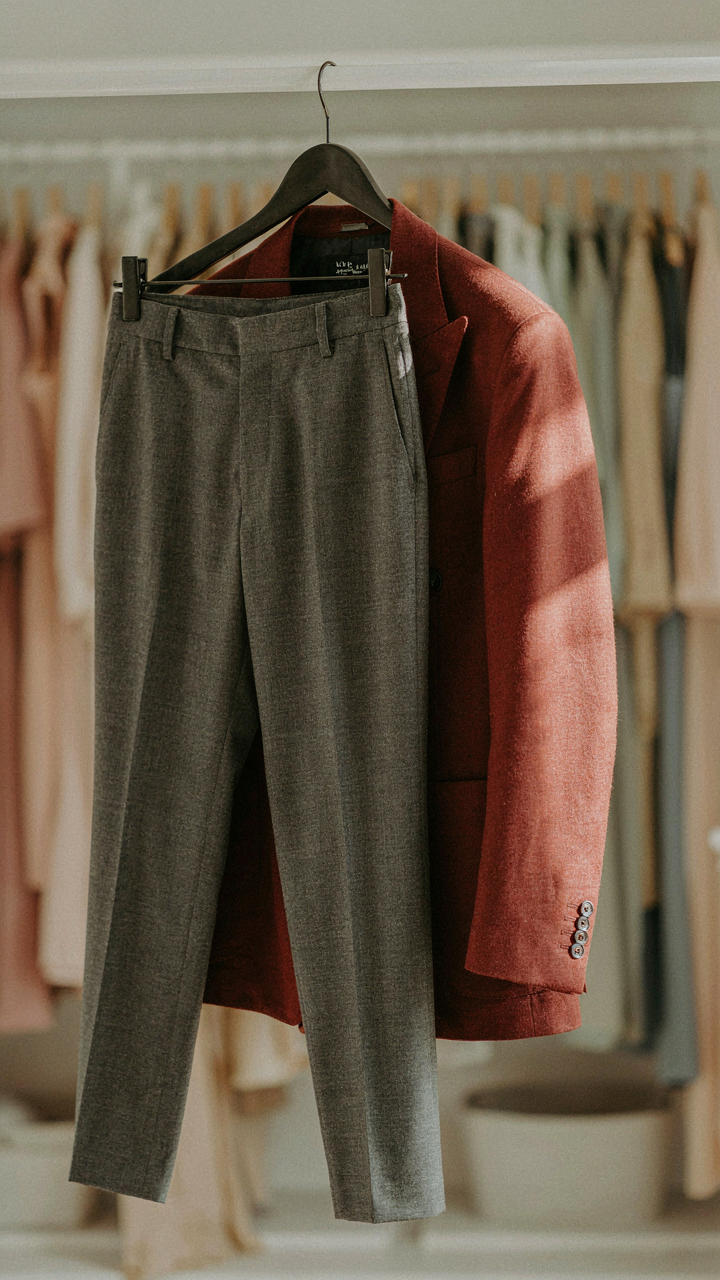 A matched set of trousers is paired with a contrasting, structured blazer.