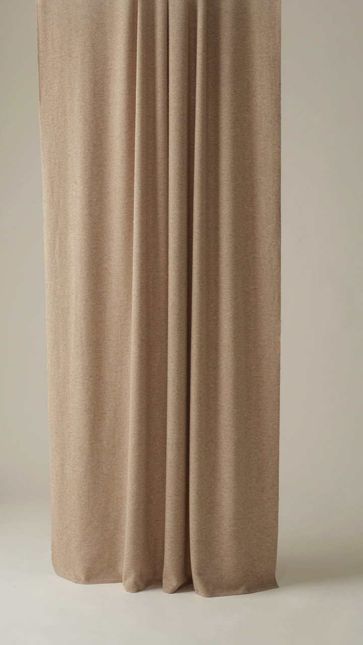 A luxurious cashmere blend fabric drapes cleanly, holding its structure when tested.