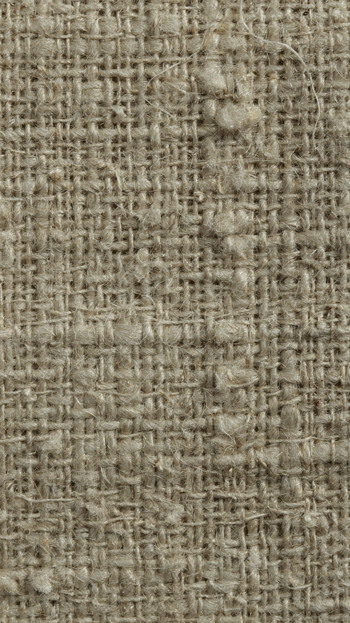 Extreme close up of loosely woven linen fabric.