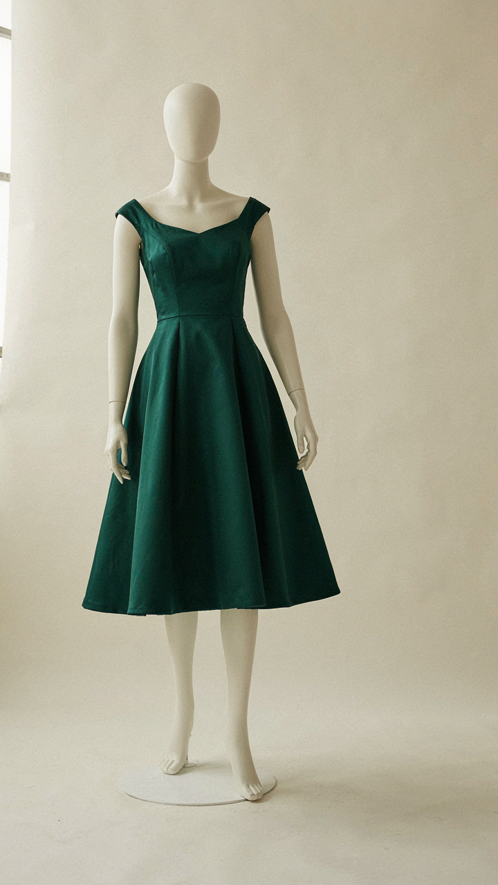 Mannequin wearing a structured fit and flare cocktail dress bodice.