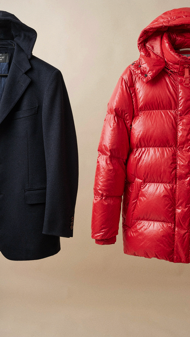 A classic navy wool blazer next to a new, bright synthetic jacket.