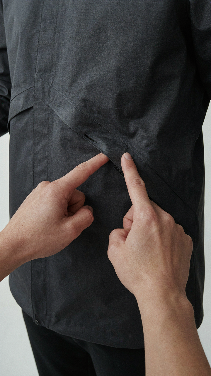 A close-up shows the sealed seam of a hardshell jacket, indicating waterproofing.