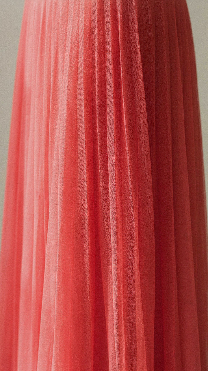 Close-up of a pleated tulle skirt, showing crisp box pleats.