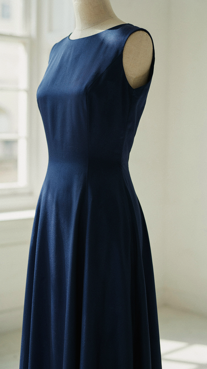 A close-up view of a luxurious sapphire blue silk dress.