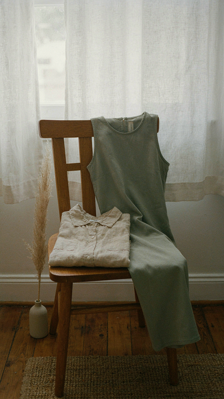 A linen shirt and a sleeveless modest dress are ready for layering.