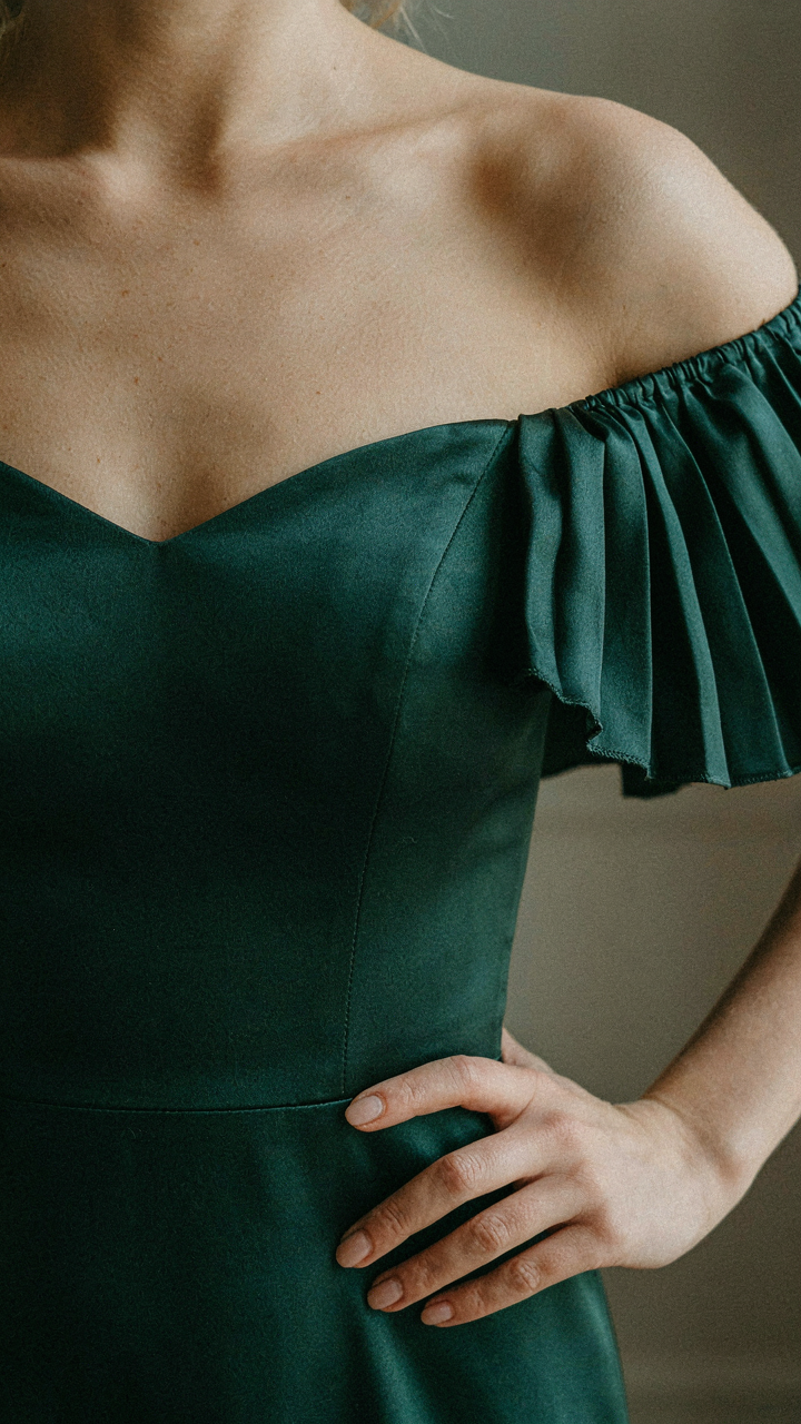 Close-up of a flutter sleeve on an off shoulder cocktail dress.