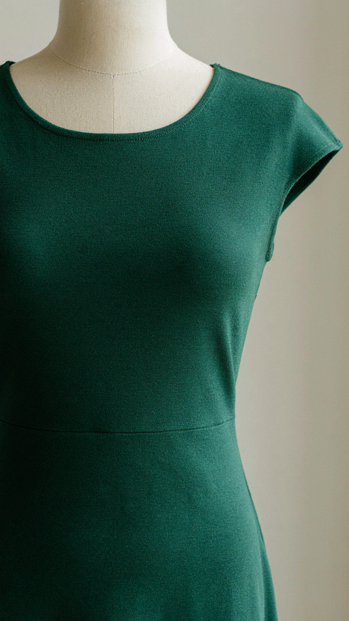 A Ponte knit dress, holding its shape, ideal for summer casual cocktail attire.