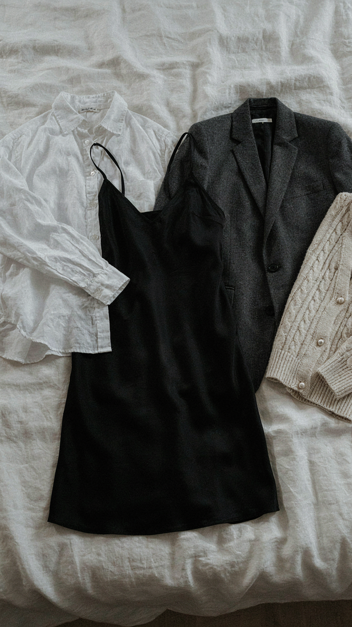 A black slip dress is shown with a linen shirt, blazer, and cardigan for three outfits.