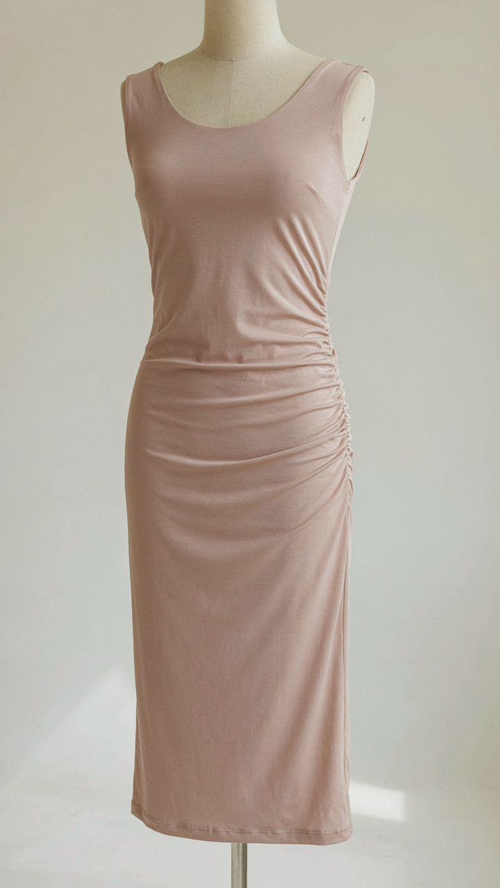 Midi dress with vertical ruching along the side, shaping the silhouette.