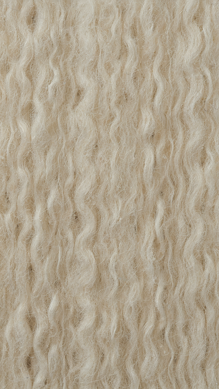 Magnified view of merino wool fabric showing tiny air pockets for insulation.