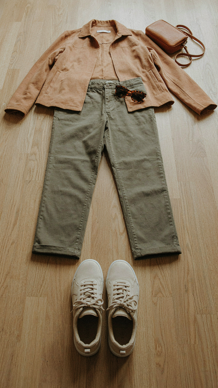 A simple, comfortable outfit for a day trip is laid out neatly.