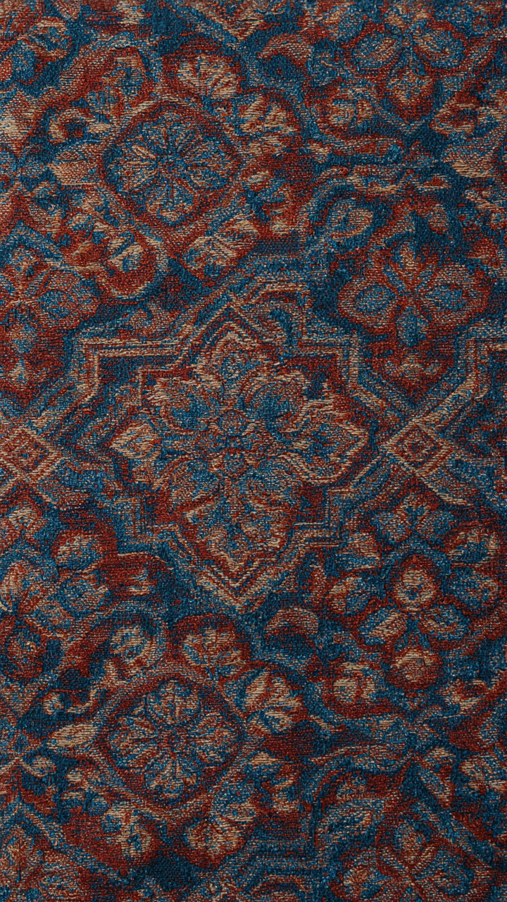A close-up of a complex jacquard fabric pattern.