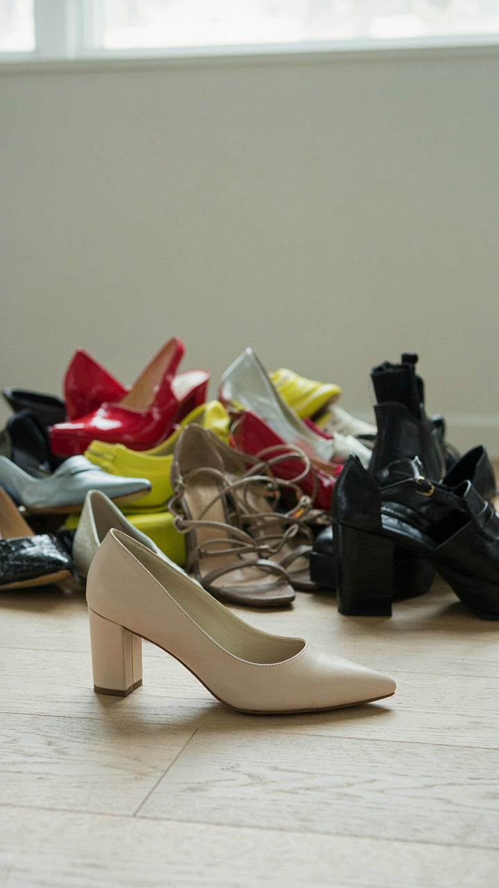 One well-constructed comfortable heel, with many other shoes blurred behind it.