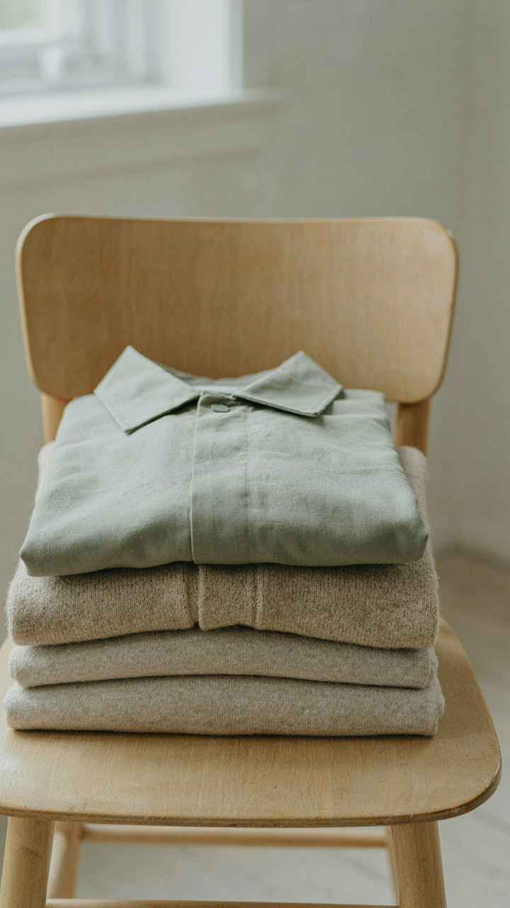 Three folded layers of clothing for temperature regulation on a flight.