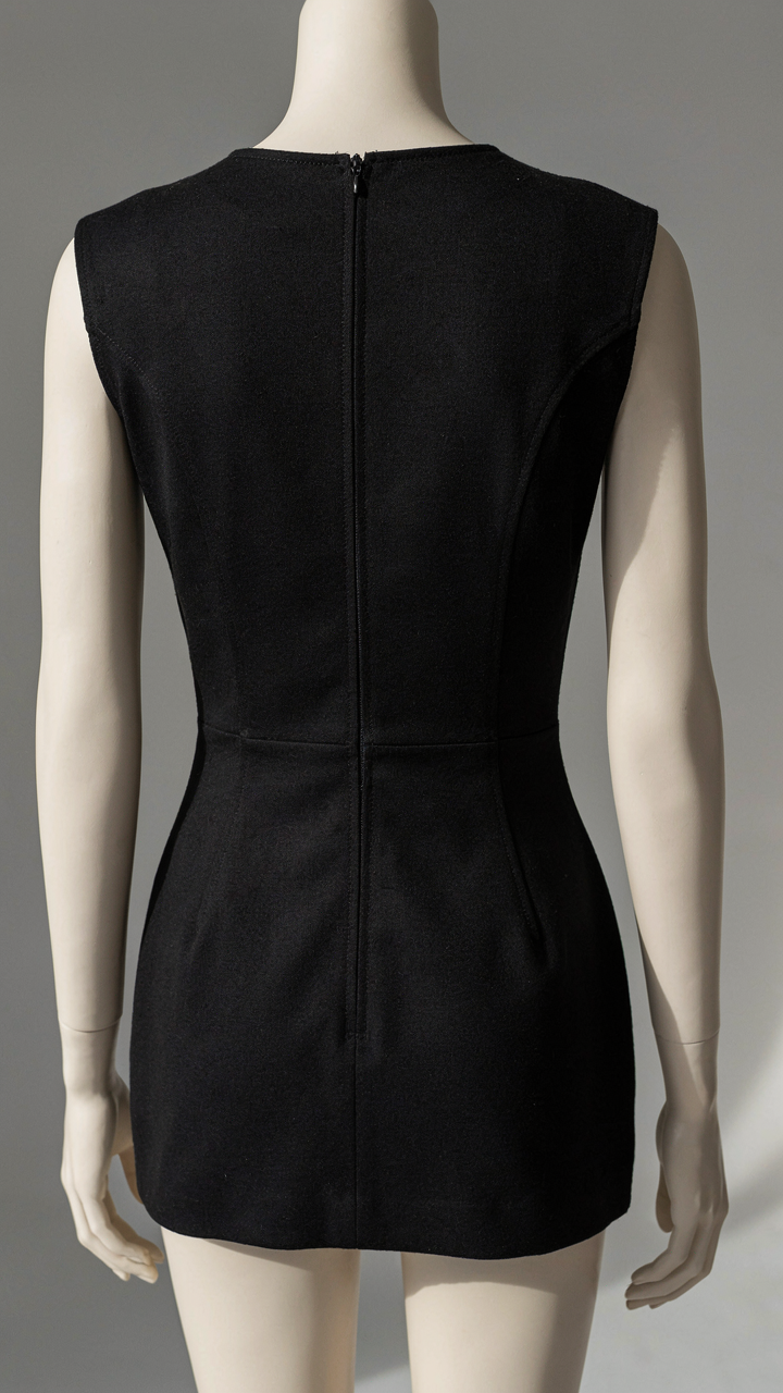 A close-up of a perfectly stitched seam on a black dress.