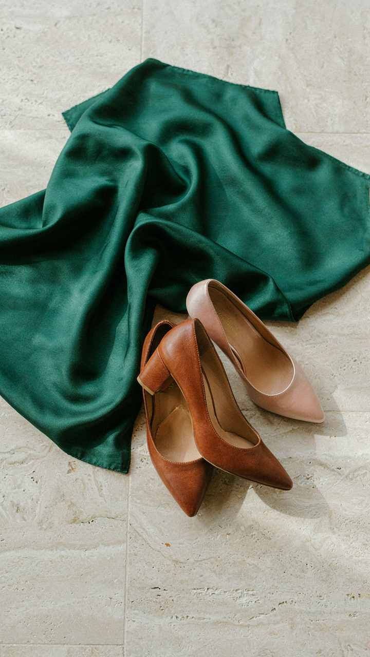 Heavy silk fabric next to a leather pump and a satin shoe to wear with a cocktail dress.