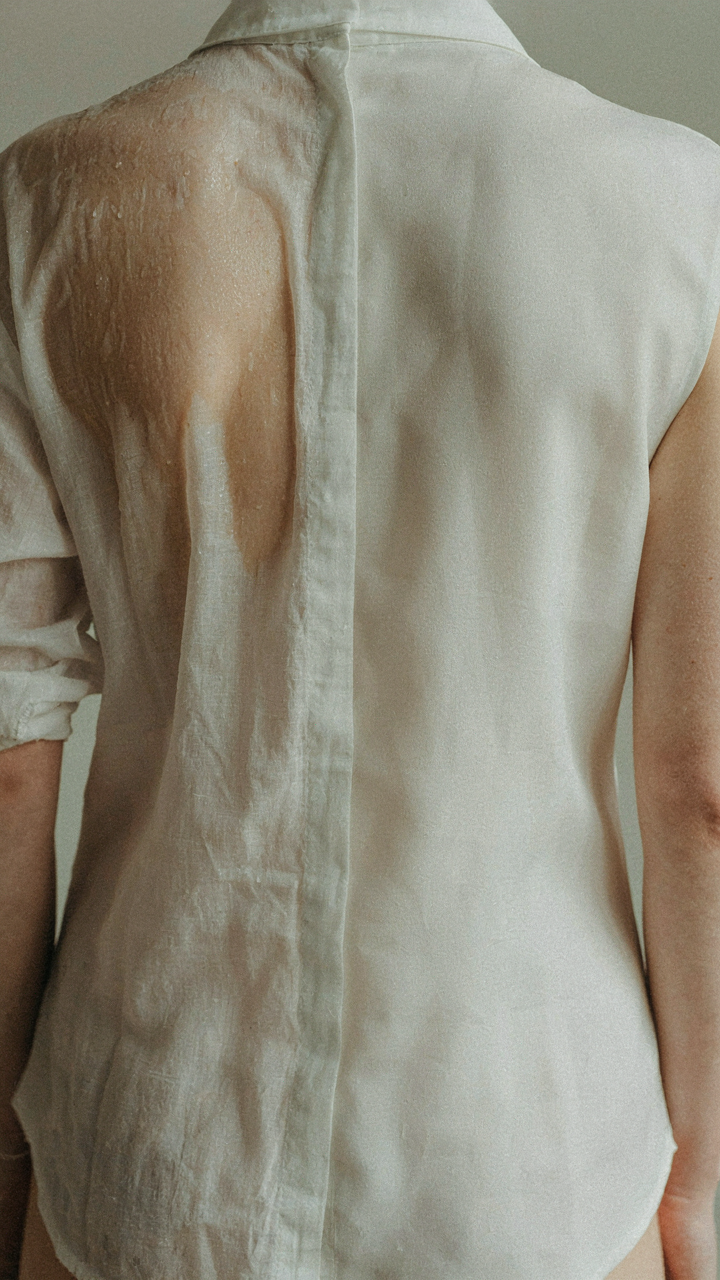 A damp linen shirt clings to skin next to a dry synthetic fabric.