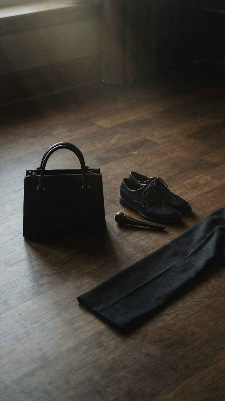 A structured handbag and leather oxford shoes ready for a smart casual evening.