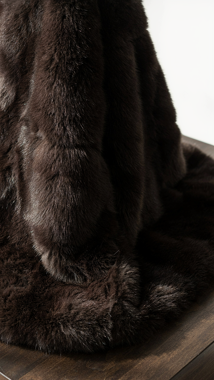 Close-up of a luxurious faux fur wrap evening piece with deep, uniform pile.
