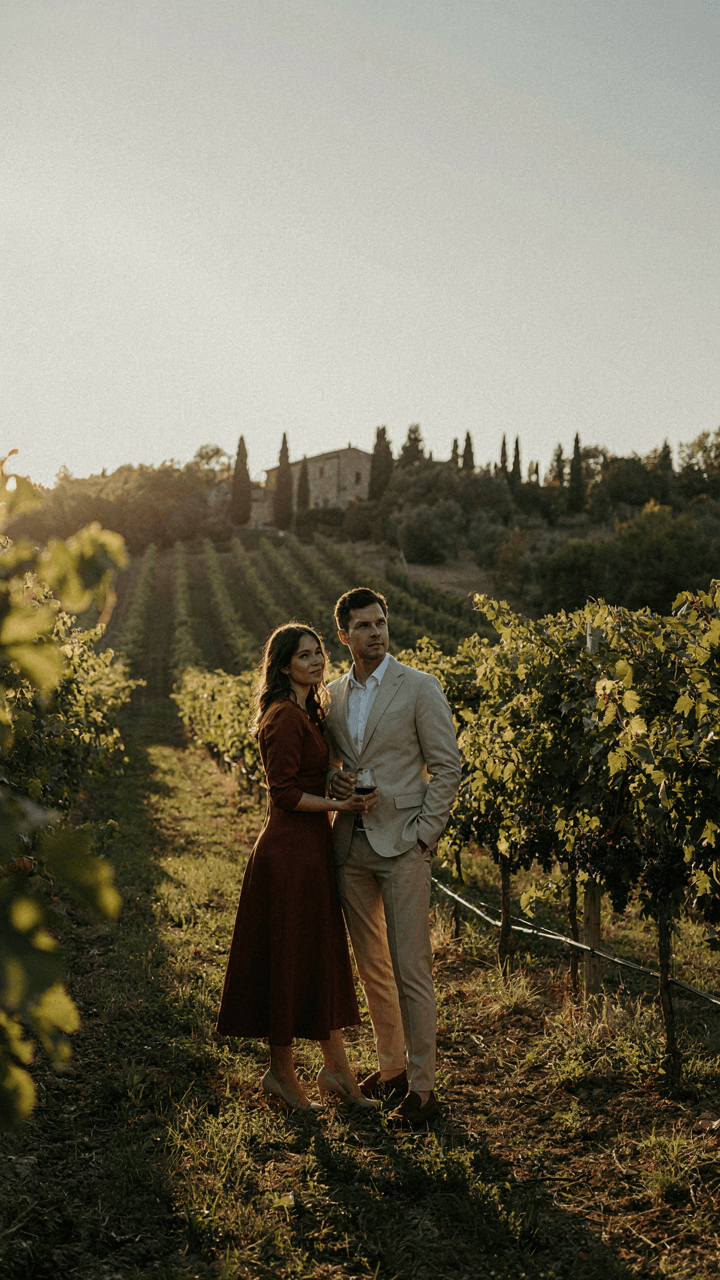 A man and woman wear tailored, breathable outfits in a vineyard setting.