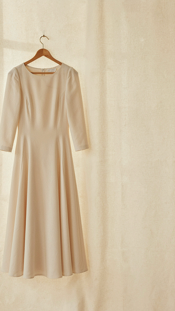 A classic A-line dress made of high-quality silk blend fabric.