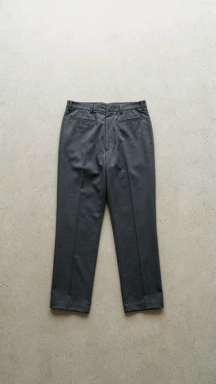 A pair of high-rise, straight-leg trousers with a crisp crease.