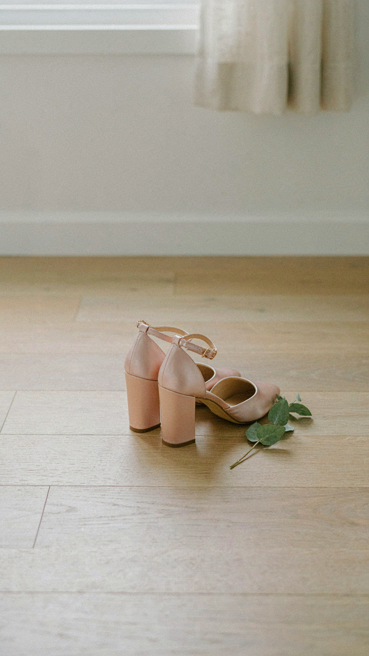 Stylish block heels wedding guest shoes wait on a clean floor.